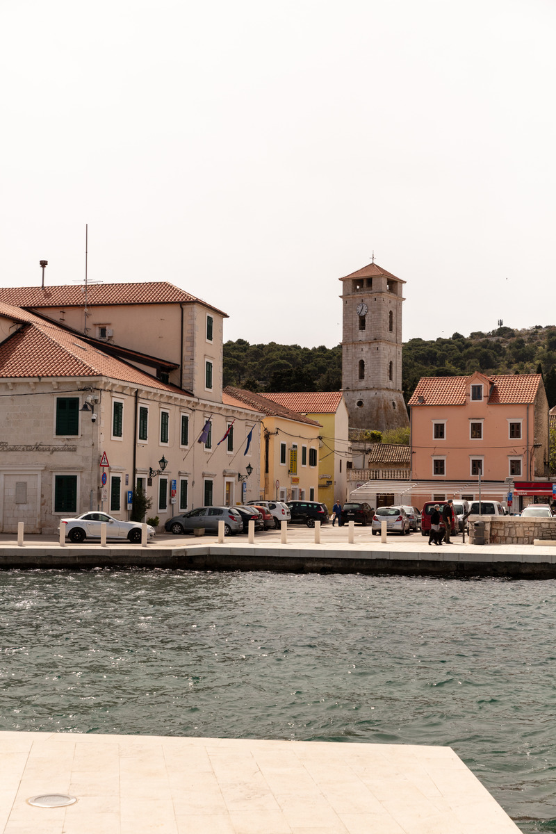 Tisno bell tower above the waterfront