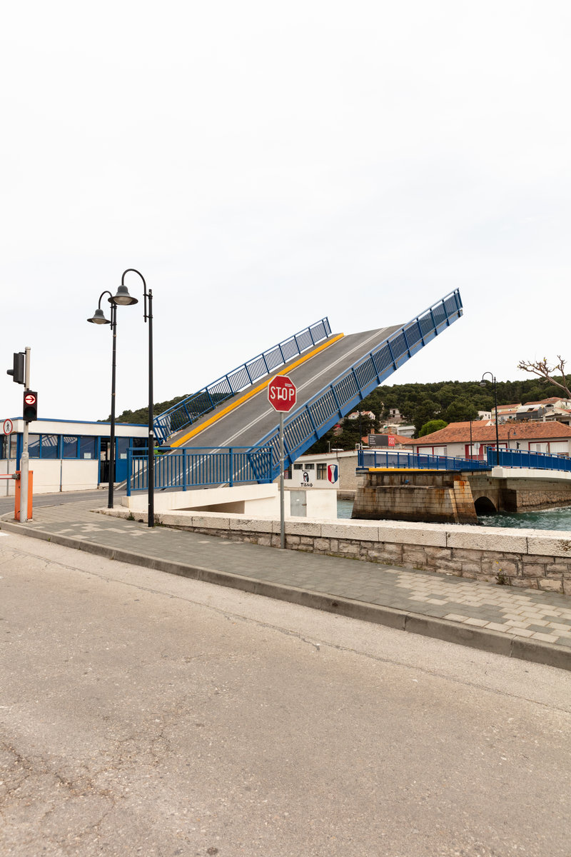 Open drawbridge with traffic sign