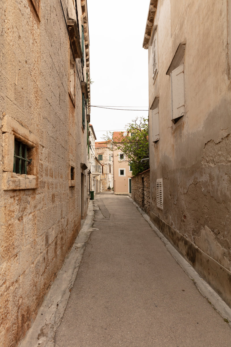 Narrow alley through the historic centre